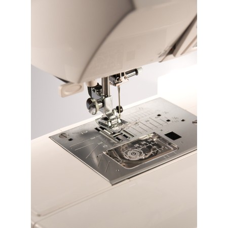 Šijací stroj Janome 607 TXL + predlžovací stôl